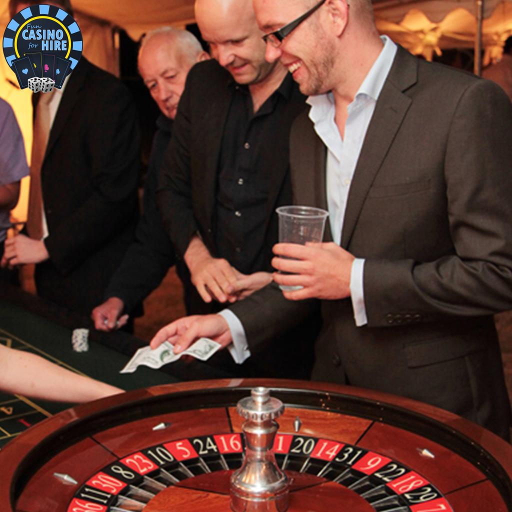 Men playing roulette at a wedding